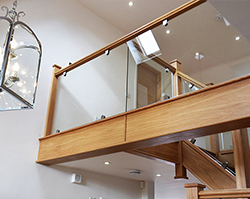 A stylish glass balcony made from clear glass.