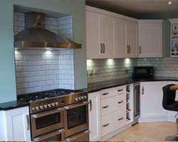 A modern kitchen extension that keep rustic elements in its design.