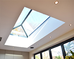The sun shining through a stylish skylight.